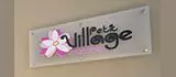 Logotipo do Petit Village Orquídea