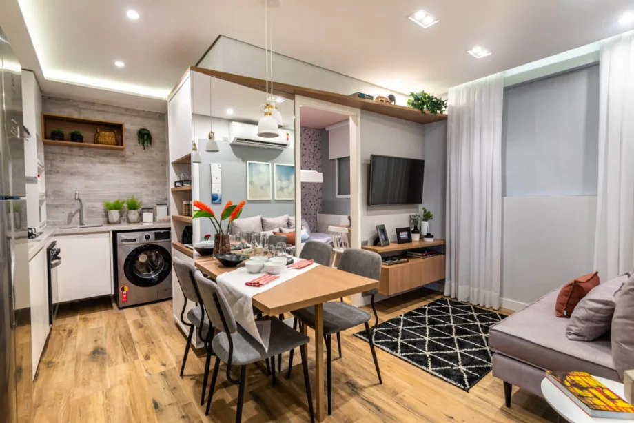 SALA do apto de 34 m² interligada à cozinha com conceito aberto, um espaço fluido e perfeito para quem gosta de receber convidados.
