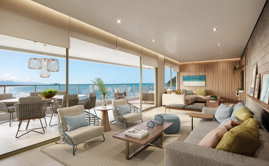 LIVING do apto de 165 m² com ampla abertura permitindo iluminação natural no interior da residência e incrível vista para a orla da praia.
